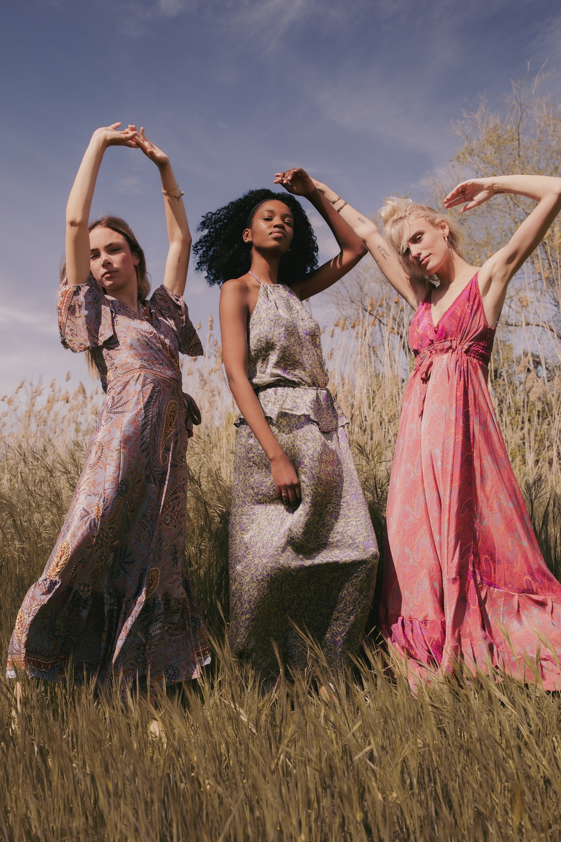 Portrait of Diverse Women in Stylish Dresses in the Field